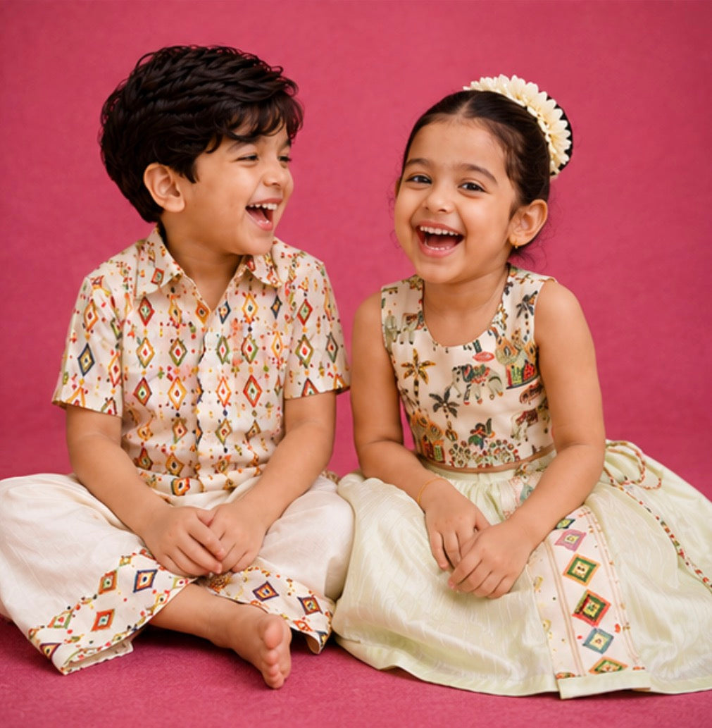 A boy and a girl laughing together in coordinated Nuts festive outfits